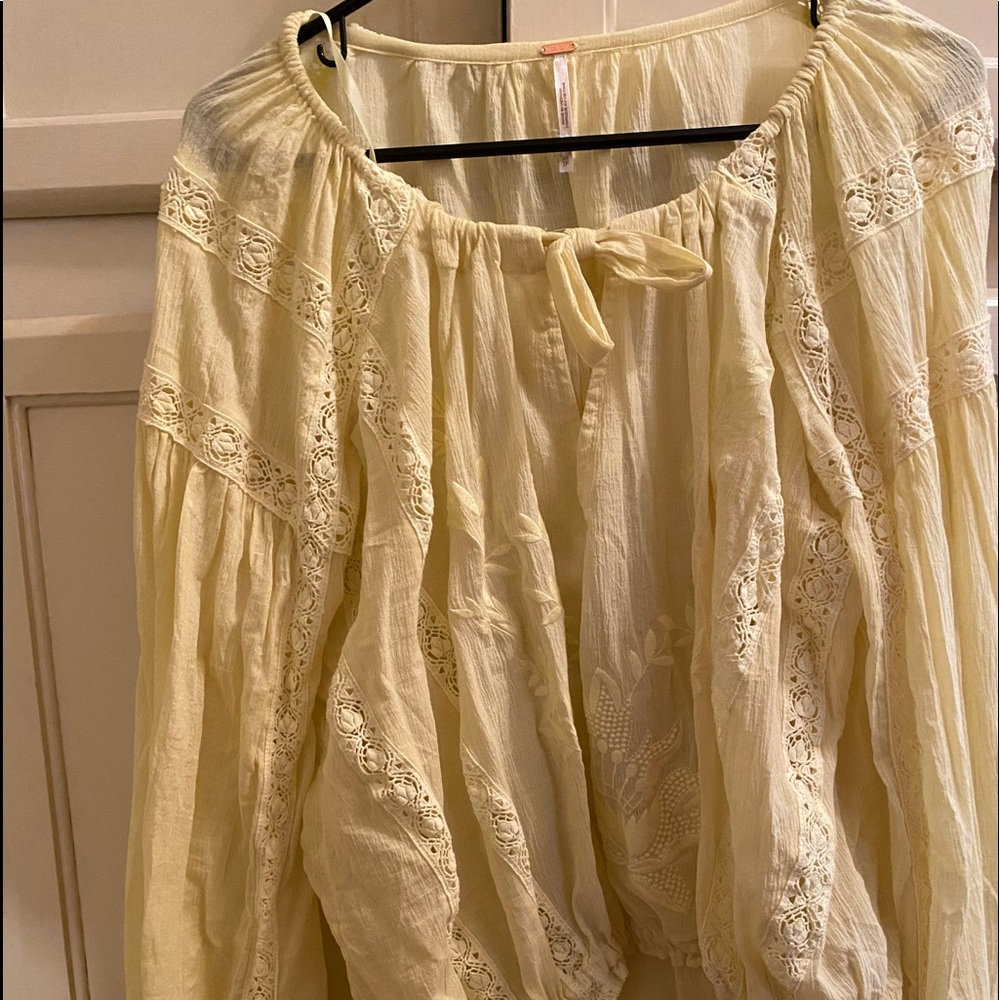 Pretty Free People blouse. Would look great for your spring wardrobe!